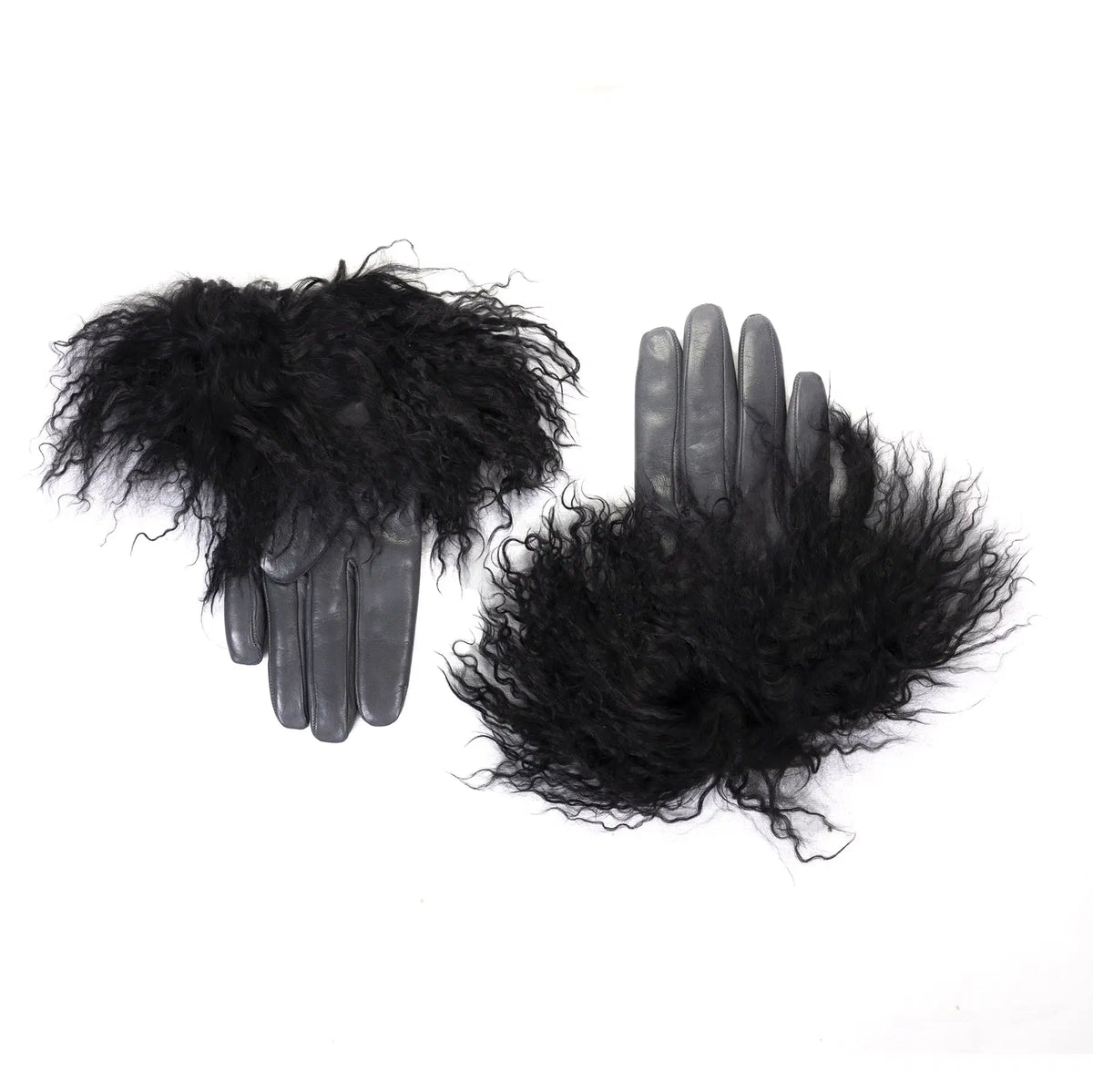 Womens black nappa leather gloves adorned with plush Mongolian fur, showcasing luxurious Italian craftsmanship and elegant design.